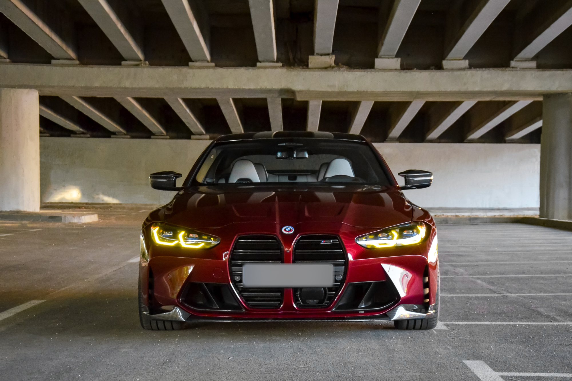 Front of the G82 M4 with a PixelA Carbon front splitter, in a Sofia car park